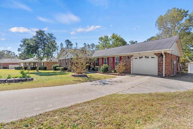 ranch-style house featuring a garage and a front lawn