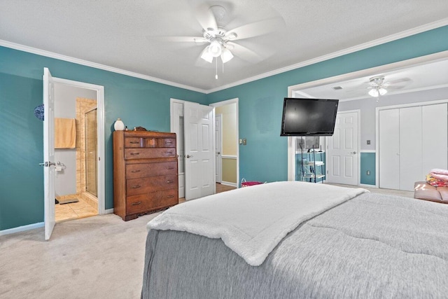 carpeted bedroom featuring ensuite bath, ceiling fan, crown molding, and a textured ceiling