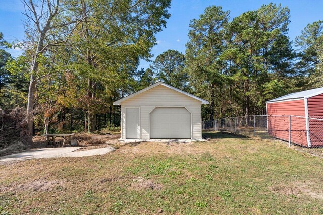 garage with a yard