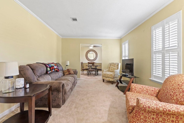 carpeted living room with ornamental molding