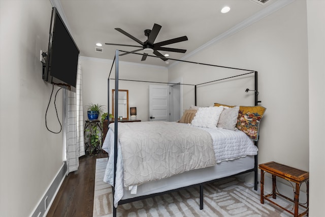 bedroom featuring crown molding, dark wood-type flooring, and ceiling fan