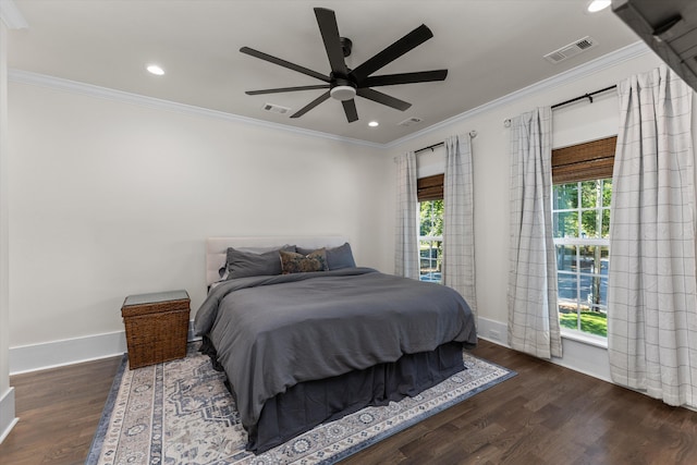 bedroom featuring crown molding, ceiling fan, and dark hardwood / wood-style floors