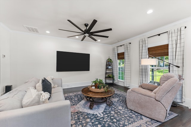 living room featuring dark hardwood / wood-style flooring, ornamental molding, and ceiling fan