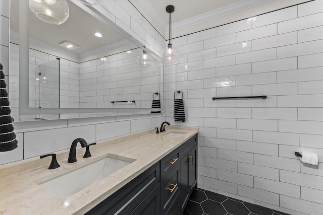 bathroom featuring crown molding, tile walls, and vanity