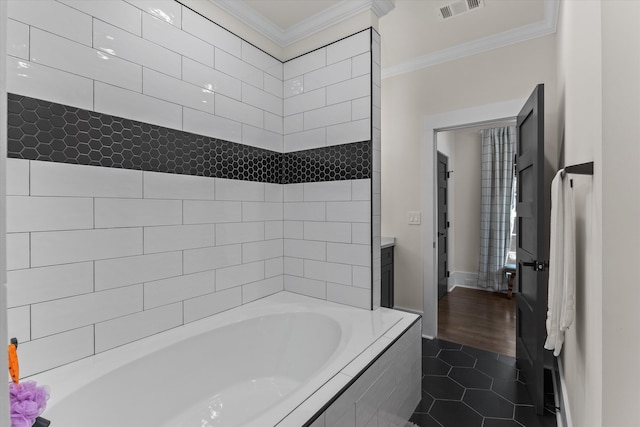 bathroom with vanity, tile patterned floors, ornamental molding, and tiled bath