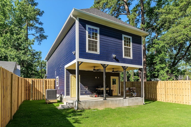 back of house with a patio area, central AC unit, ceiling fan, and a lawn