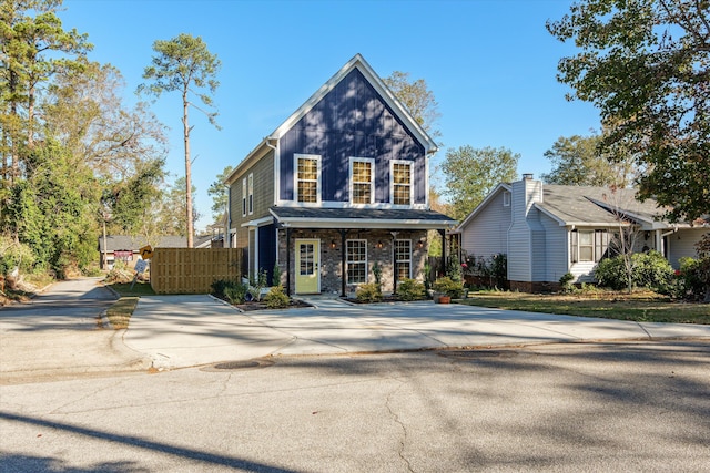 view of property featuring covered porch