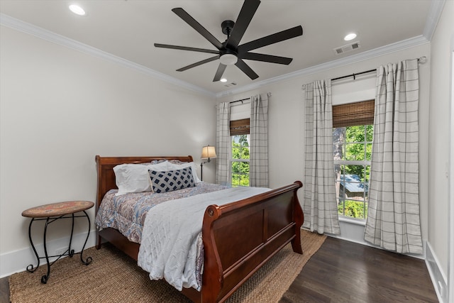 bedroom featuring crown molding, dark hardwood / wood-style floors, and ceiling fan