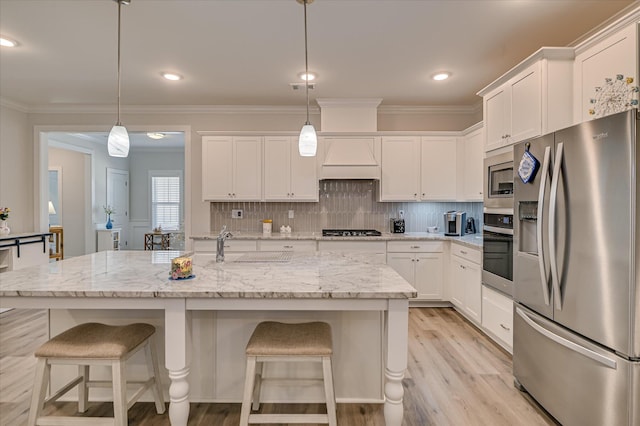 8073 Crossbow Lndg, Graniteville, SC 29829 - kitchen with stainless steel appliances, white cabinets, crown molding, decorative backsplash, and light wood-type flooring