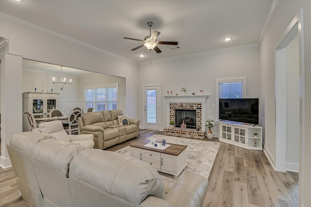 8073 Crossbow Lndg, Graniteville, SC 29829 - living area featuring light wood-type flooring, a chandelier, ceiling fan, crown molding, and recessed lighting