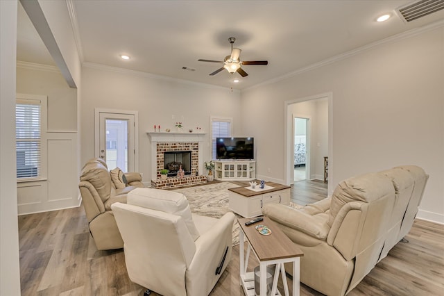 8073 Crossbow Lndg, Graniteville, SC 29829 - living area with light wood finished floors, ceiling fan, crown molding, recessed lighting, and a fireplace