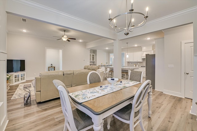 8073 Crossbow Lndg, Graniteville, SC 29829 - dining space with light wood-style floors, a chandelier, ceiling fan, ornamental molding, and baseboards