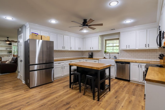 2700 Summit Ridge Rd, Evans, GA 30809 - kitchen featuring butcher block countertops, appliances with stainless steel finishes, ceiling fan, white cabinets, and recessed lighting