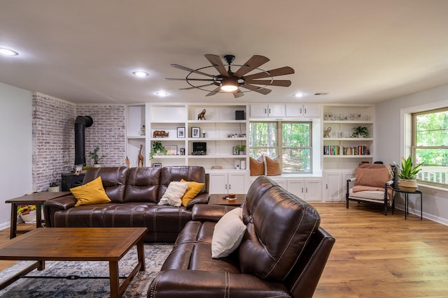 2700 Summit Ridge Rd, Evans, GA 30809 - living area featuring a wood stove, ceiling fan, light wood-style floors, and recessed lighting