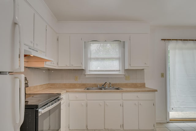 3409 Arden Ct, Augusta, GA 30906 - kitchen featuring stainless steel range with electric stovetop, a sink, under cabinet range hood, white cabinets, and freestanding refrigerator