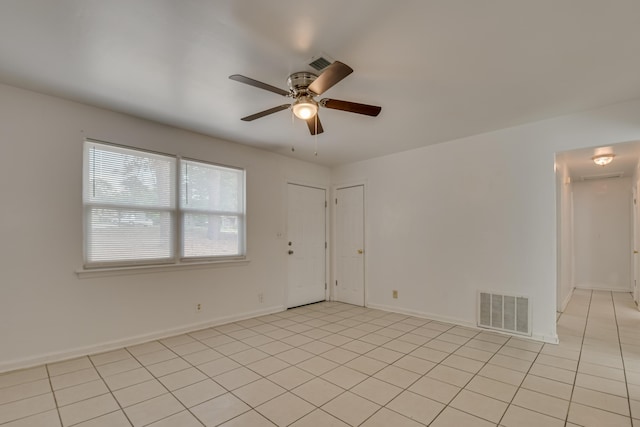 3409 Arden Ct, Augusta, GA 30906 - spare room featuring light tile patterned floors, visible vents, a ceiling fan, and baseboards