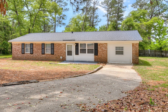 3409 Arden Ct, Augusta, GA 30906 - single story home with roof with shingles, a patio area, fence, and brick siding