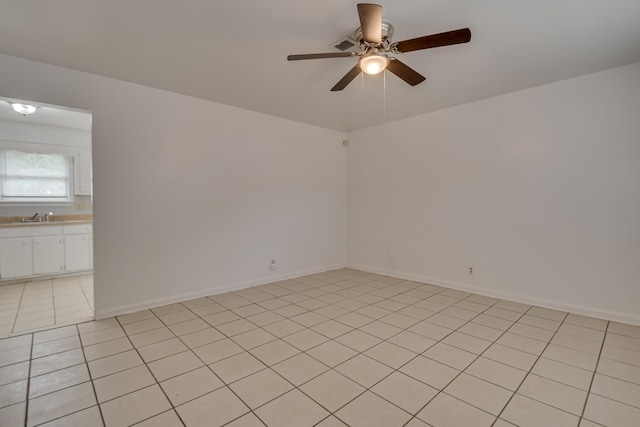 3409 Arden Ct, Augusta, GA 30906 - empty room with light tile patterned floors, a sink, ceiling fan, and baseboards