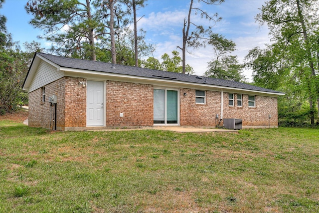 3409 Arden Ct, Augusta, GA 30906 - rear view of property featuring a lawn, central AC unit, a patio, and brick siding