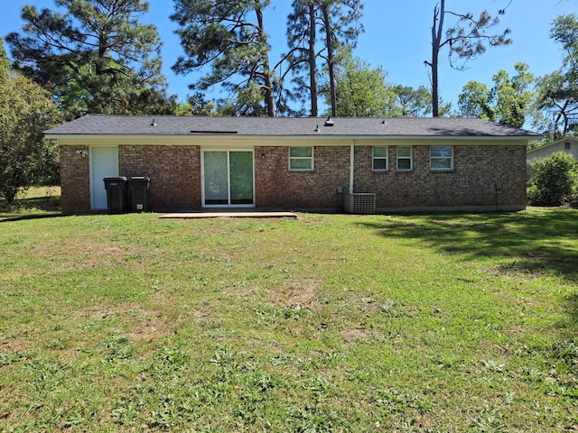 3409 Arden Ct, Augusta, GA 30906 - rear view of house with a lawn, central AC unit, and brick siding