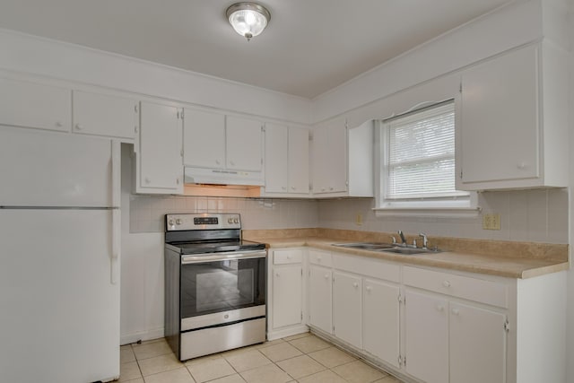 3409 Arden Ct, Augusta, GA 30906 - kitchen with light countertops, freestanding refrigerator, under cabinet range hood, light tile patterned flooring, and stainless steel electric range