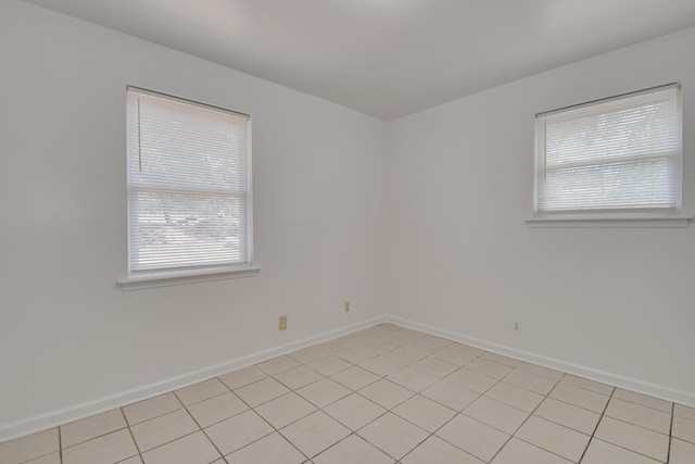 3409 Arden Ct, Augusta, GA 30906 - unfurnished room with baseboards, light tile patterned floors, and a healthy amount of sunlight