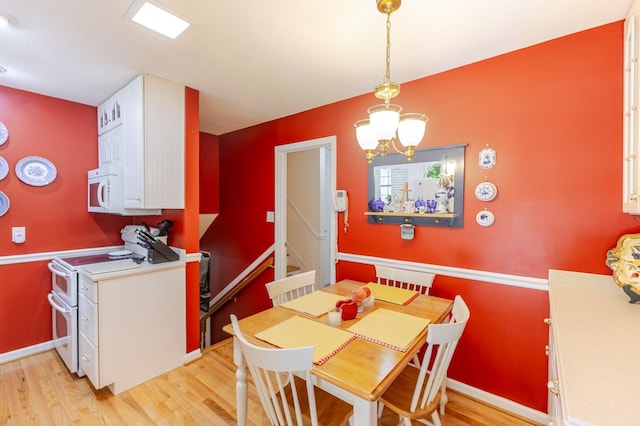 2161 Chadwick Rd, Augusta, GA 30906 - dining space with light wood-type flooring and a chandelier