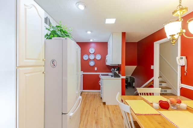 2161 Chadwick Rd, Augusta, GA 30906 - kitchen with white appliances, light wood-style flooring, and white cabinets