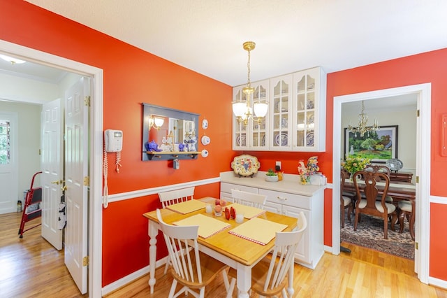 2161 Chadwick Rd, Augusta, GA 30906 - dining space featuring a chandelier and light wood-style flooring