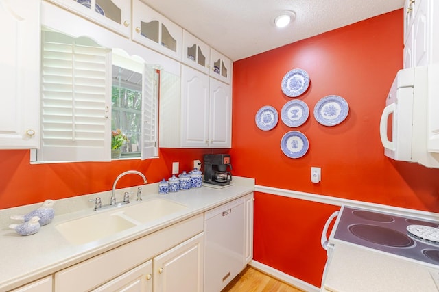 2161 Chadwick Rd, Augusta, GA 30906 - kitchen featuring white appliances, white cabinetry, light countertops, and light wood-style floors