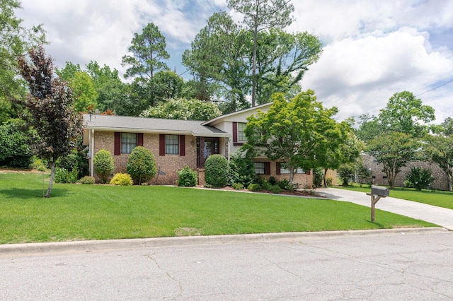 2161 Chadwick Rd, Augusta, GA 30906 - split level home with brick siding, a front yard, and concrete driveway