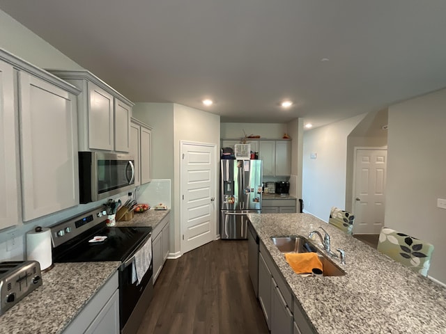 134 Grindle Shls, Grovetown, GA 30813 - kitchen with stainless steel appliances, a sink, gray cabinets, light stone counters, and recessed lighting