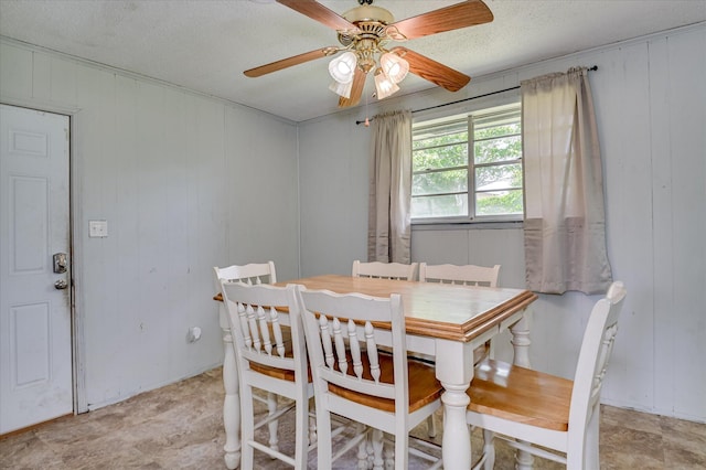 2314 Canberra Ct, Augusta, GA 30906 - dining room with ceiling fan, a textured ceiling, and wood walls