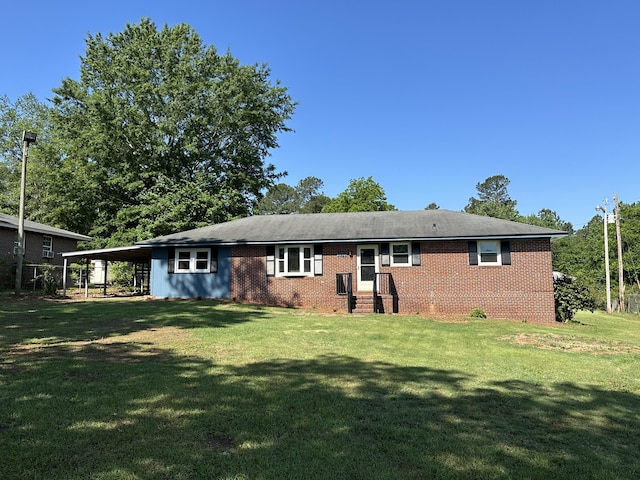 view of front facade featuring a carport and a front yard