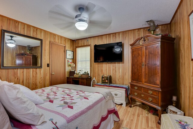 2960 Old Thomson Rd, Appling, GA 30802 - bedroom with wooden walls, ceiling fan, and wood finished floors