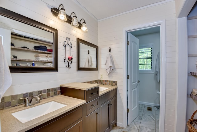 2960 Old Thomson Rd, Appling, GA 30802 - bathroom featuring vanity, ornamental molding, marble finish floor, visible vents, and backsplash
