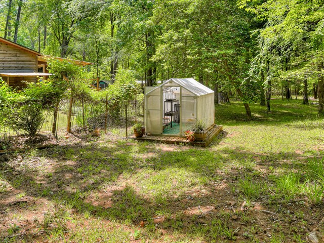 2960 Old Thomson Rd, Appling, GA 30802 - view of yard featuring an exterior structure, a forest view, and an outdoor structure