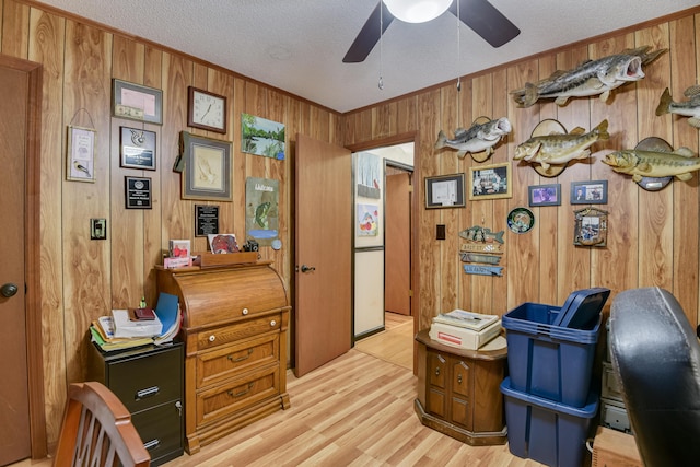 2960 Old Thomson Rd, Appling, GA 30802 - office with crown molding, ceiling fan, light wood finished floors, a textured ceiling, and wood walls