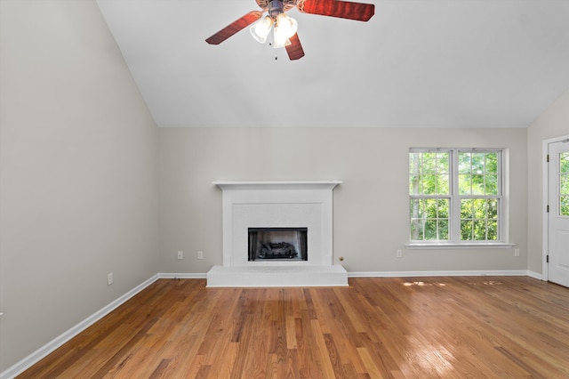 603 Ridgefield Dr, North Augusta, SC 29841 - unfurnished living room with lofted ceiling, a ceiling fan, light wood-type flooring, and a fireplace with raised hearth