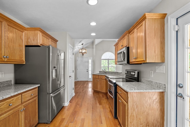 603 Ridgefield Dr, North Augusta, SC 29841 - kitchen featuring appliances with stainless steel finishes, light wood-style flooring, a chandelier, recessed lighting, and lofted ceiling