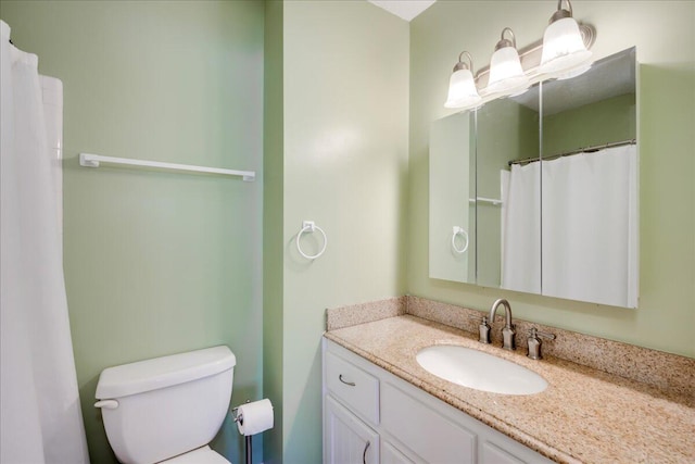 full bathroom featuring toilet and vanity
