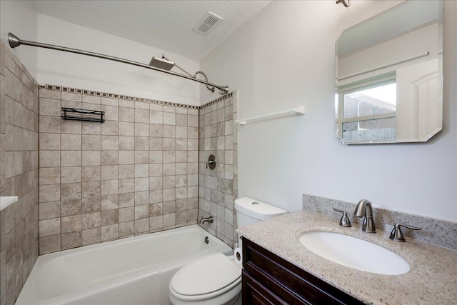 bathroom with vanity, toilet, visible vents, and bathtub / shower combination