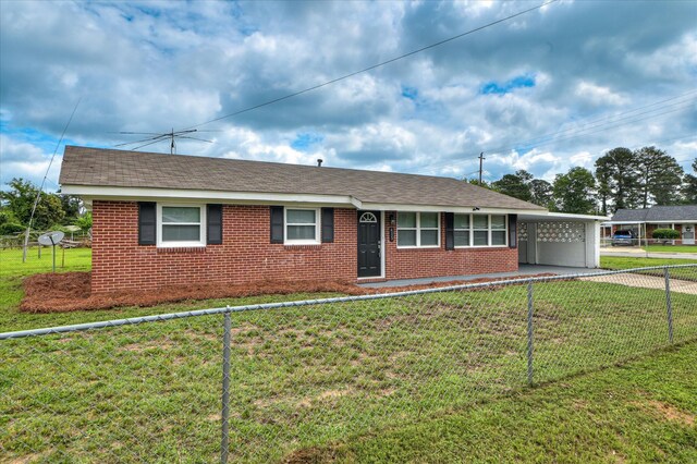 415 Aiken St, Augusta, GA 30901 - single story home featuring brick siding, a carport, driveway, and roof with shingles