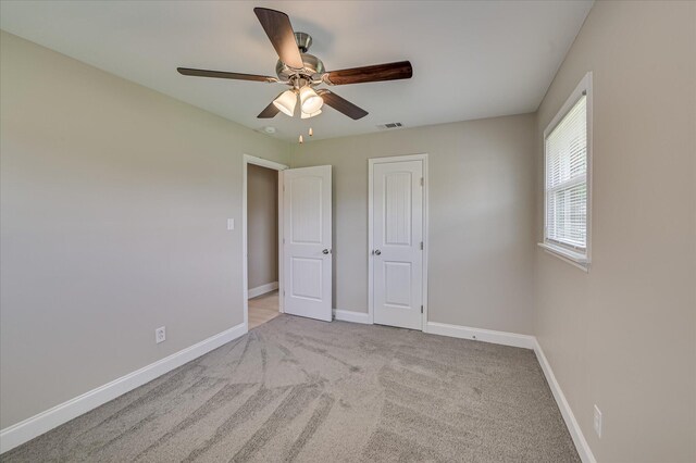 415 Aiken St, Augusta, GA 30901 - unfurnished bedroom with baseboards, carpet floors, and a ceiling fan