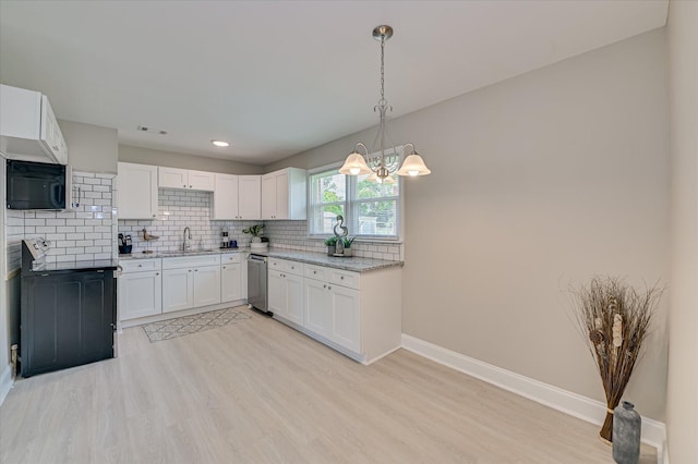 415 Aiken St, Augusta, GA 30901 - kitchen with a sink, light wood-style floors, dishwasher, a chandelier, and baseboards