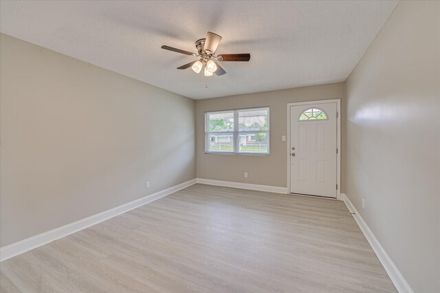 415 Aiken St, Augusta, GA 30901 - foyer featuring a ceiling fan, light wood-style floors, a textured ceiling, and baseboards