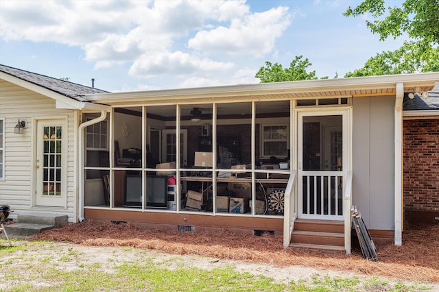 back of house featuring a sunroom