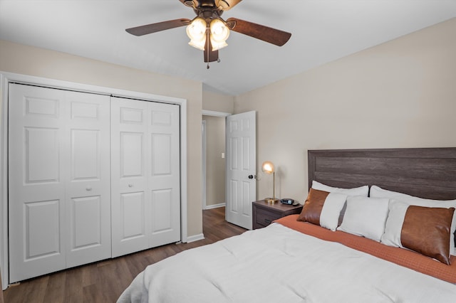 bedroom featuring a closet, ceiling fan, wood finished floors, and baseboards