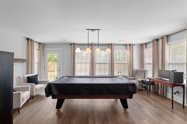 playroom with light wood-type flooring, plenty of natural light, and pool table