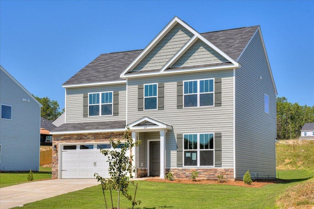 craftsman-style home with a front yard and a garage